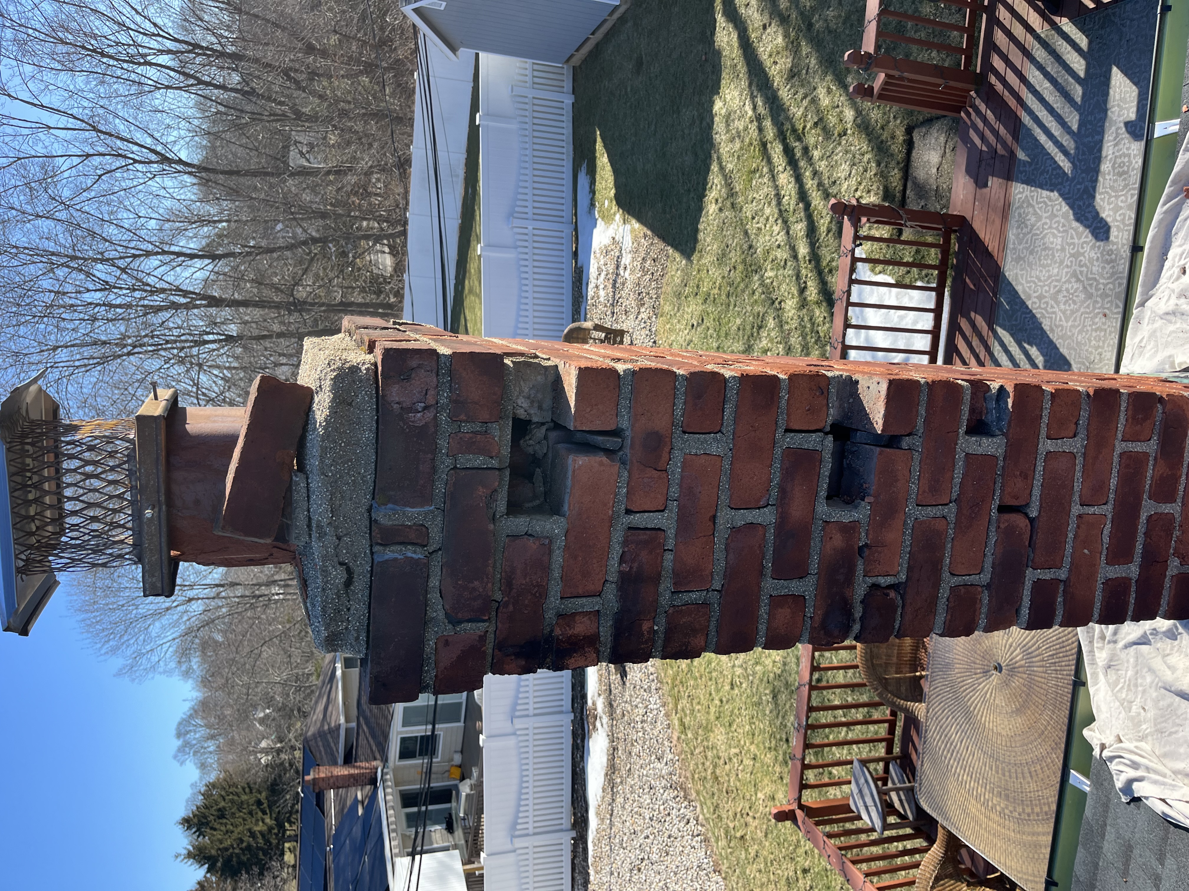 Brick chimney showing brickwork condition before Capstone repair